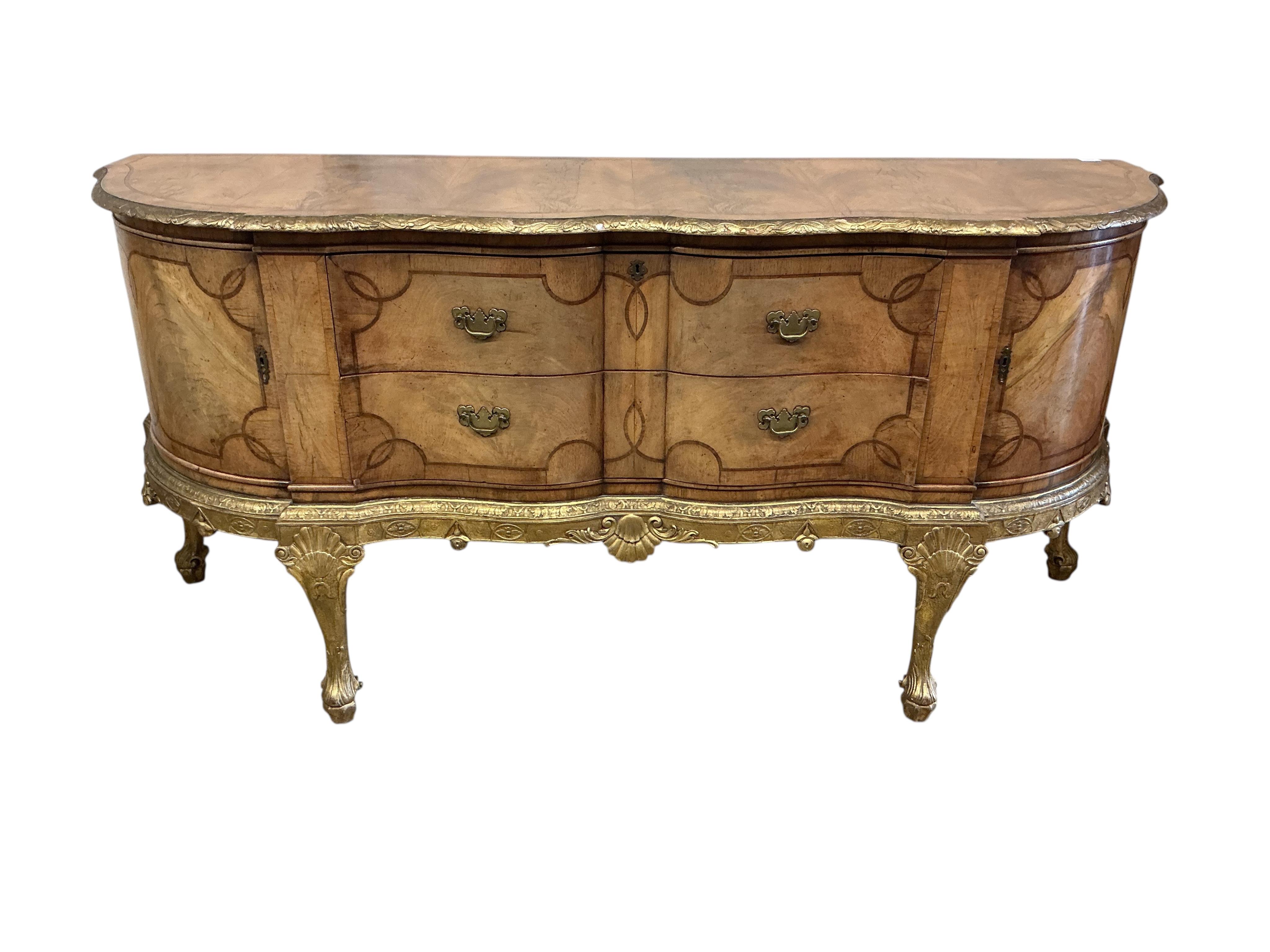 A George I style parcelgilt walnut shaped front sideboard, width 196cm, depth 60cm, height 92cm
